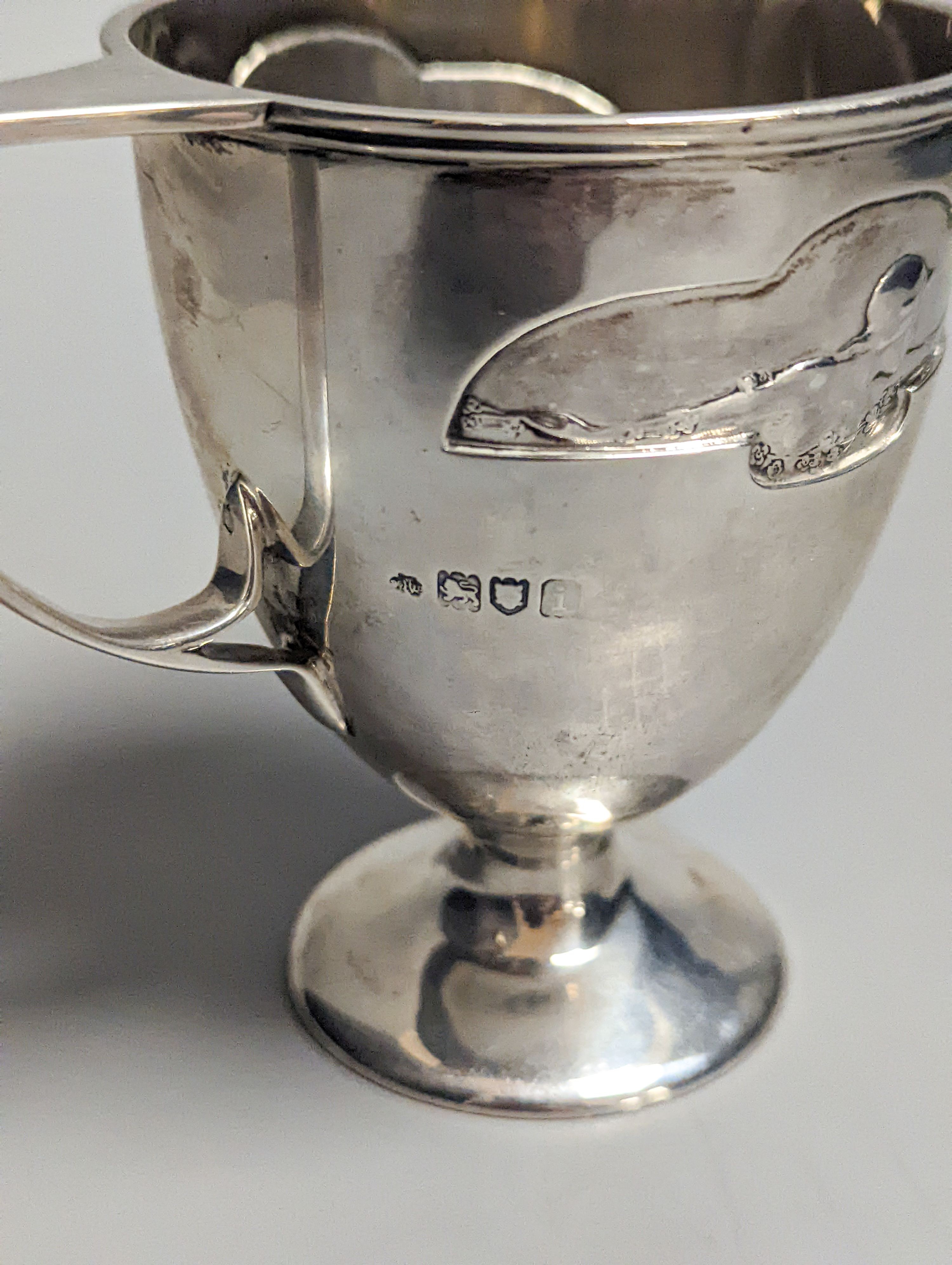 An Edwardian Art Nouveau silver pedestal christening mug, by William Hutton & Sons, London, 1904, 97mm, 138 grams.